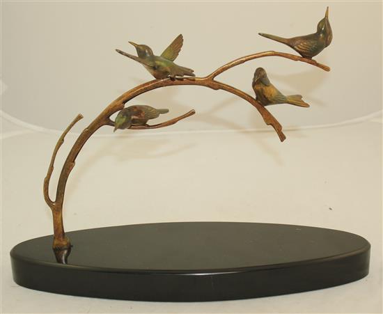 A 1920s French patinated bronze group of four birds upon a branch, L.14in.